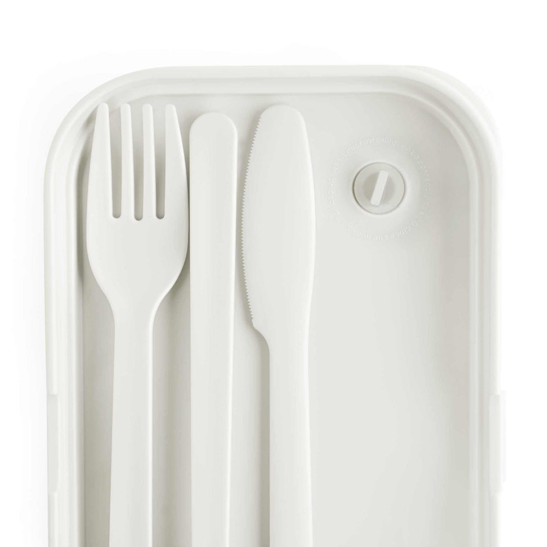 Silicone bento lunch box tray with white fork, knife, and spoon cutlery