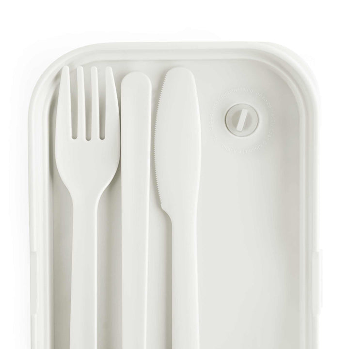 Silicone bento lunch box tray with white fork, knife, and spoon cutlery