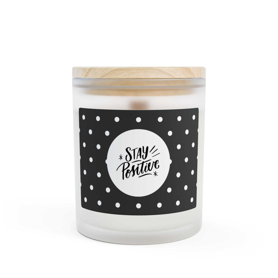 Frosted glass Stay Positive candle with wooden wick and raw maple lid, natural off-white coconut soy wax blend.