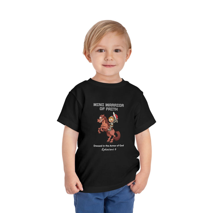 Child wearing black Warrior of Faith T-Shirt with horse warrior graphic and faith message