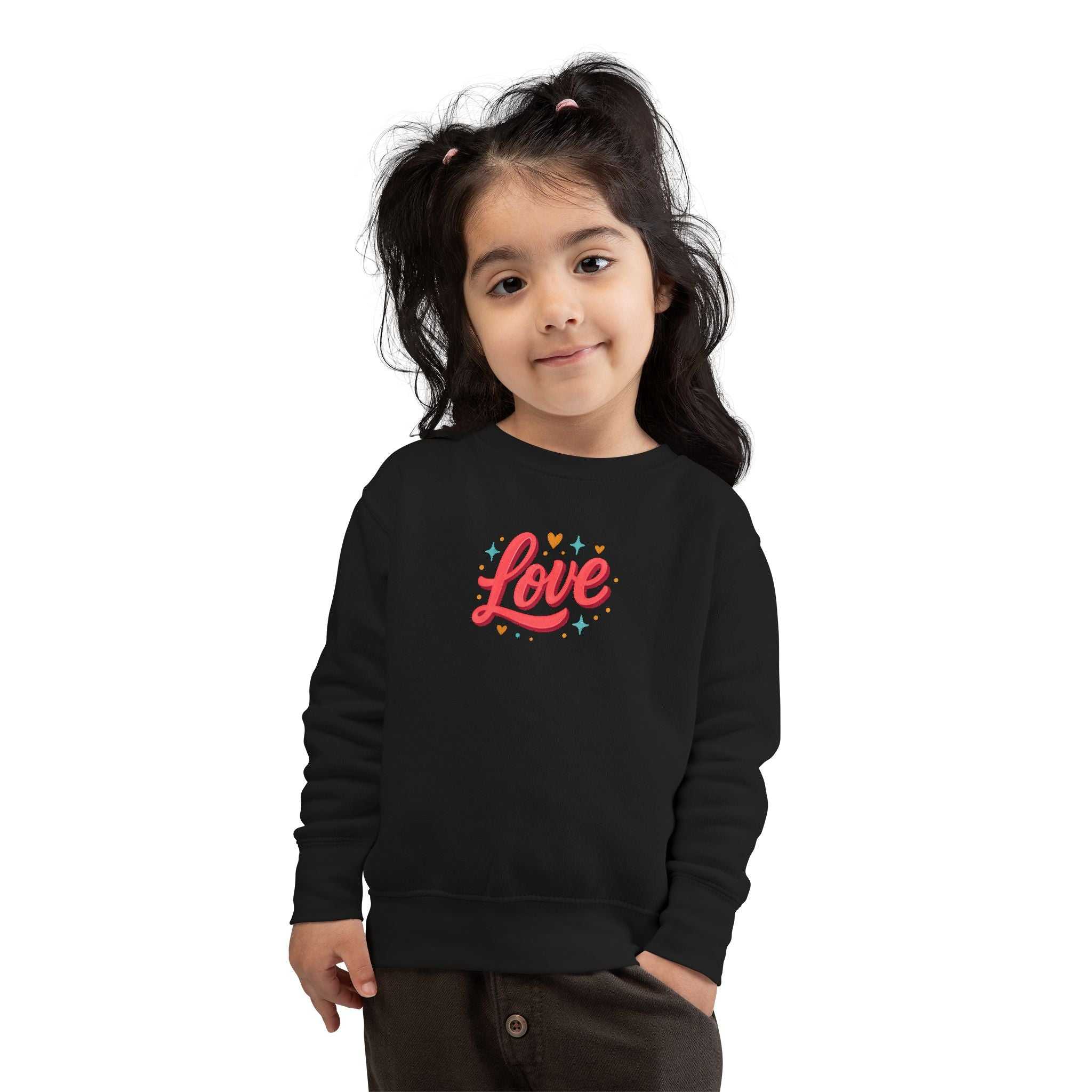 Toddler wearing a black Love Toddler Sweatshirt