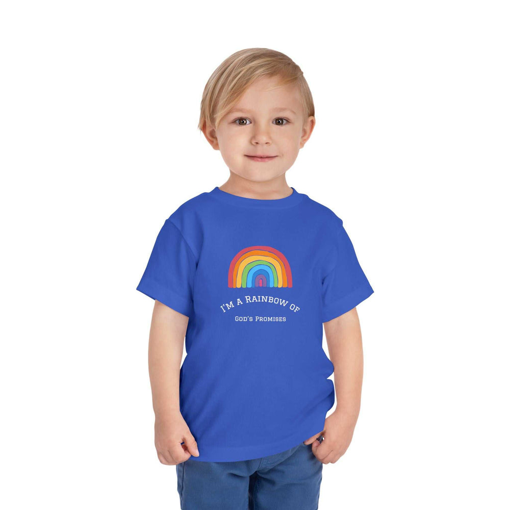 Child wearing blue T-Shirt with rainbow graphic and "I'm a Rainbow of God's Promises" text