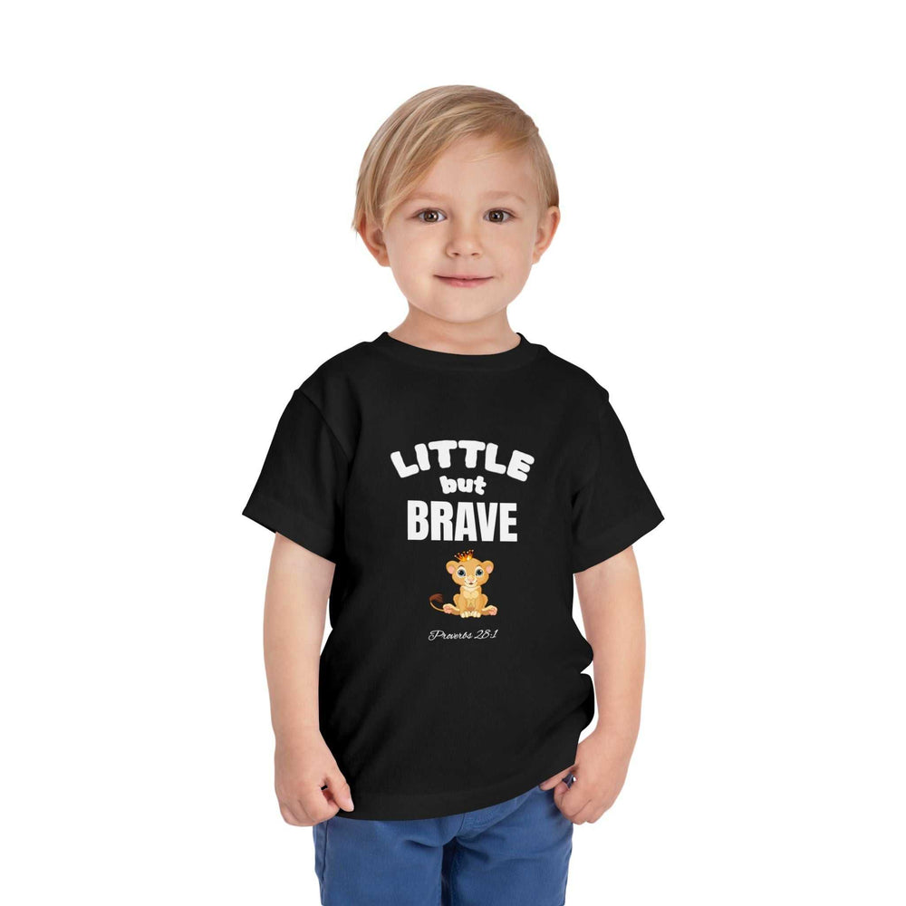 Toddler wearing black Little but Brave T-shirt with lion graphic and text, soft cotton fabric.