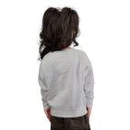 Toddler wearing gray Be Brave sweatshirt