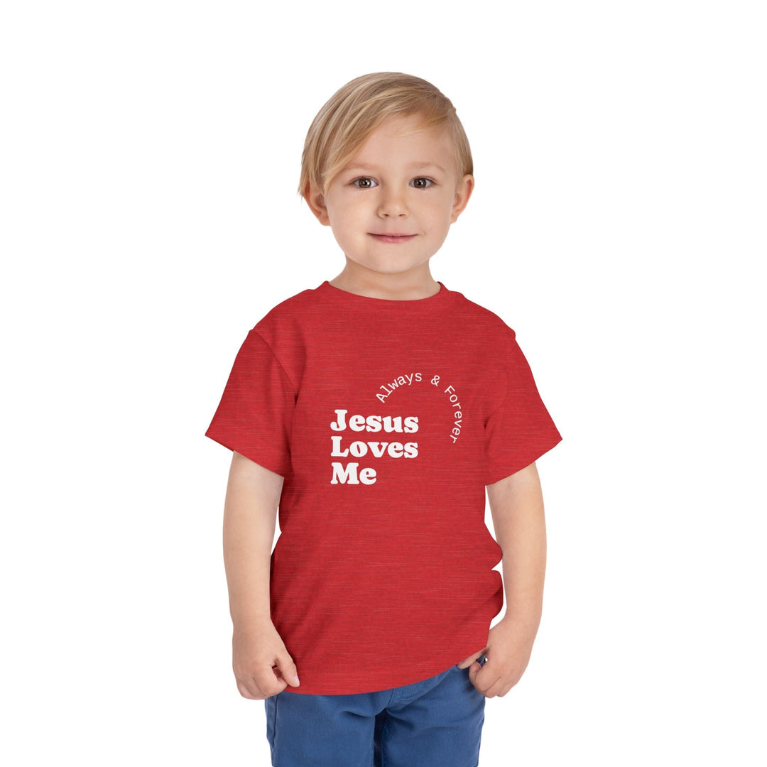 Young boy wearing a red "Jesus Loves Me" T-Shirt with white text, made of soft, lightweight cotton.
