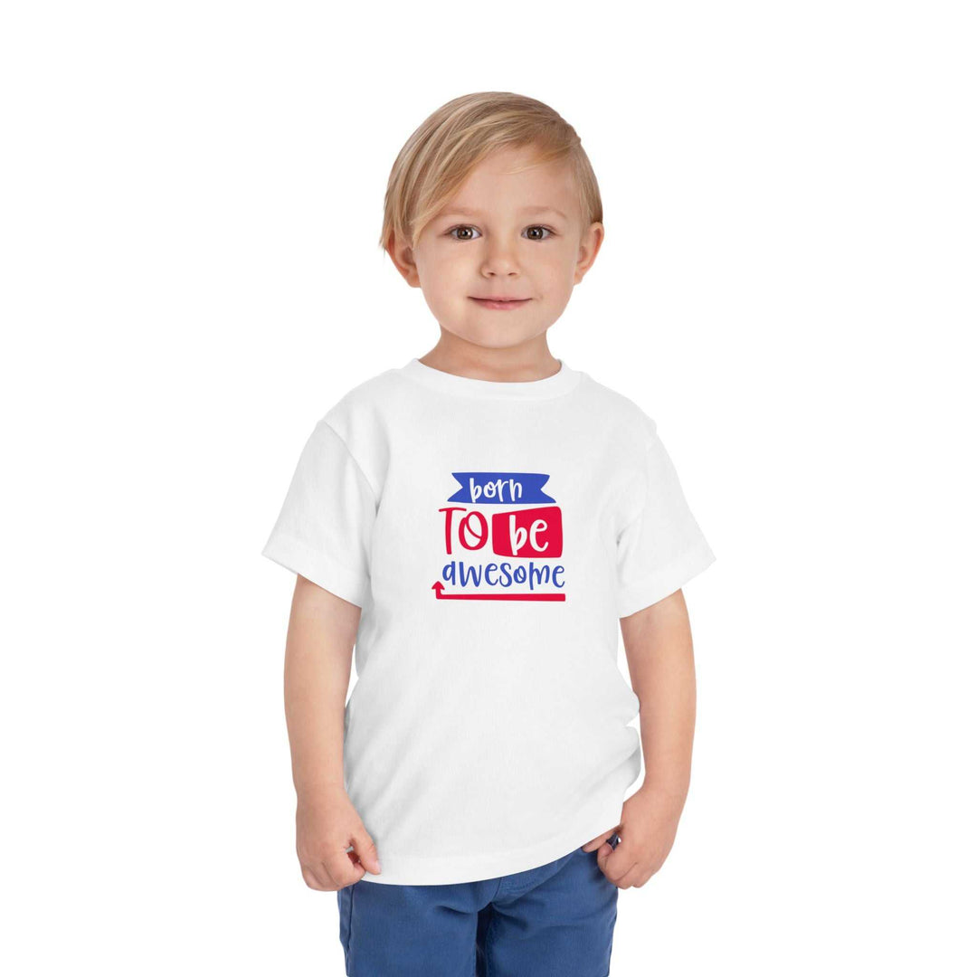 Toddler wearing white Born to Be Awesome Tee with red and blue text