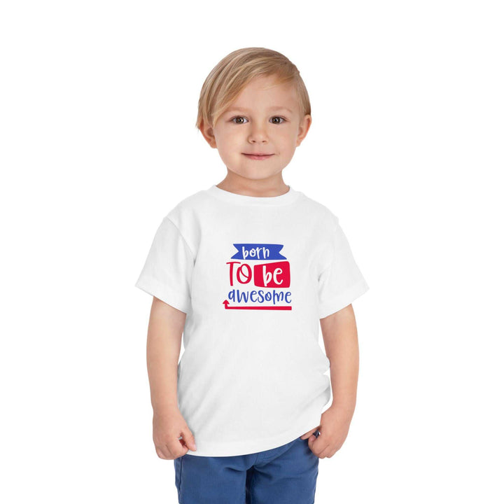 Toddler wearing white Born to Be Awesome Tee with red and blue text