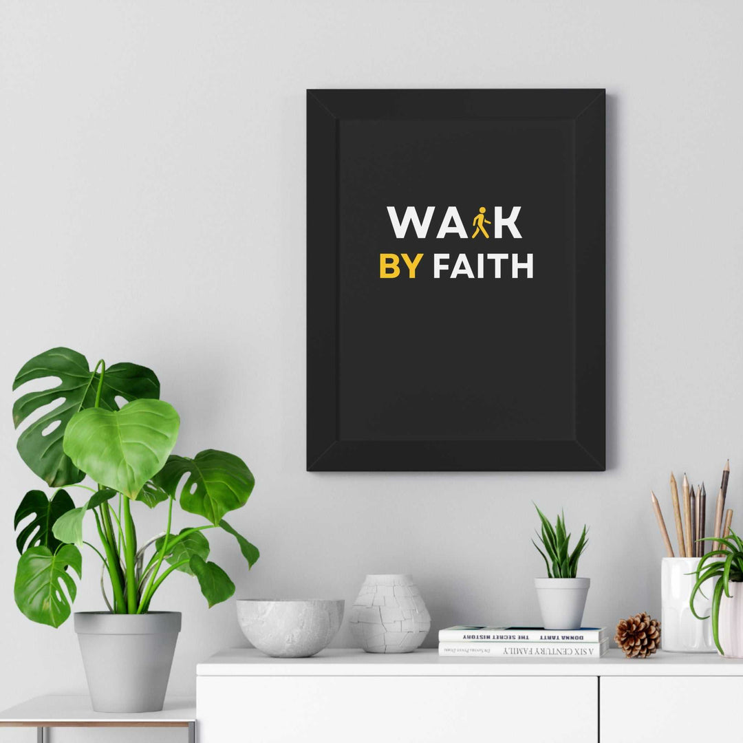 Walk by Faith poster with bold white and yellow text on black background in a black frame, displayed on a wall above a white shelf with decorative plants and books