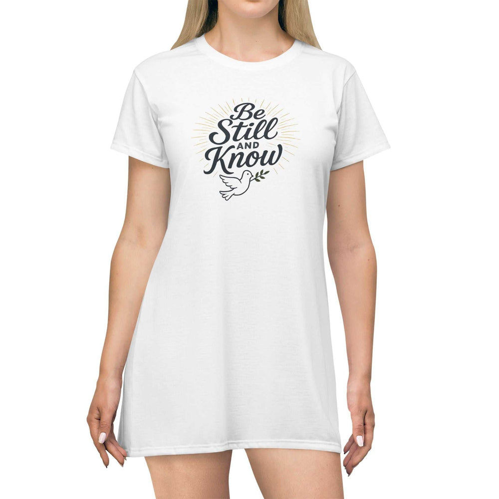 White Be Still T-Shirt Dress with printed text and dove graphic