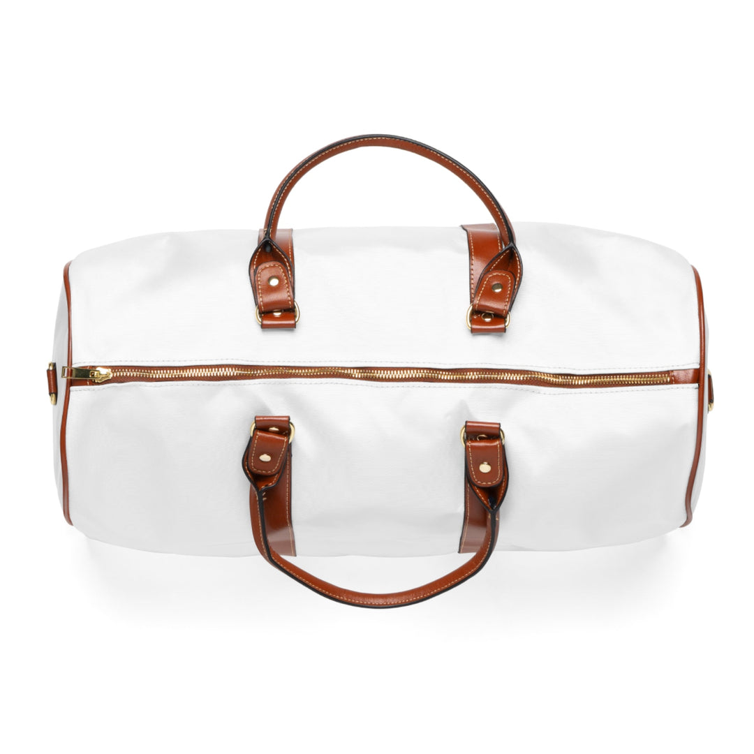 White and brown Jesus is King travel bag with gold zipper and leather handles