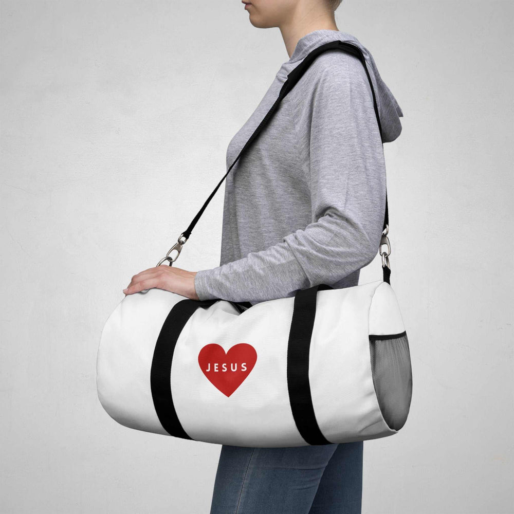 White Jesus duffel bag with black straps and red heart logo