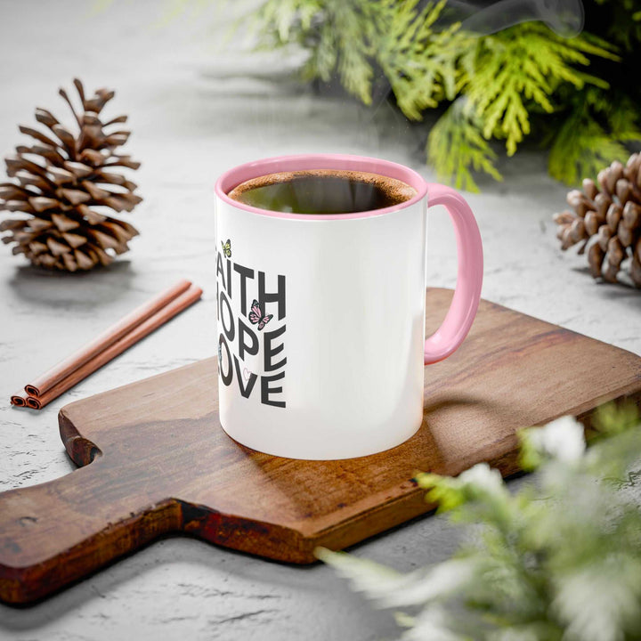 White glossy ceramic Faith Hope Love mug with pink handle and interior