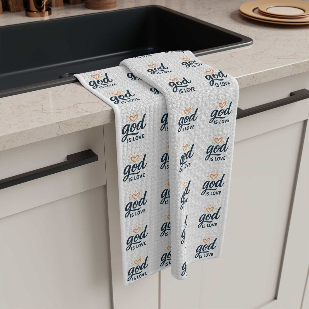 White microfiber tea towel with "God is Love" text pattern