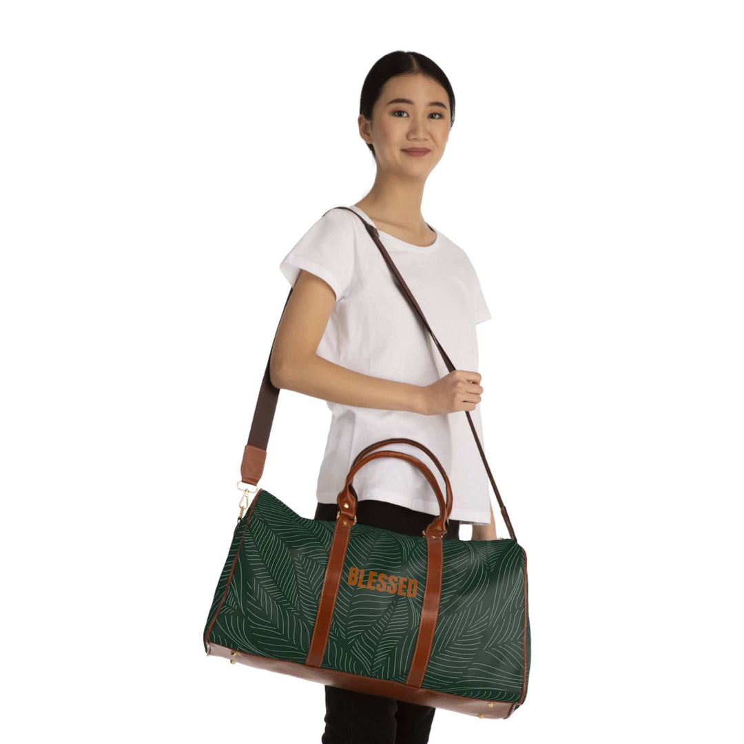 Woman carrying green tropical travel bag with brown PU leather handles