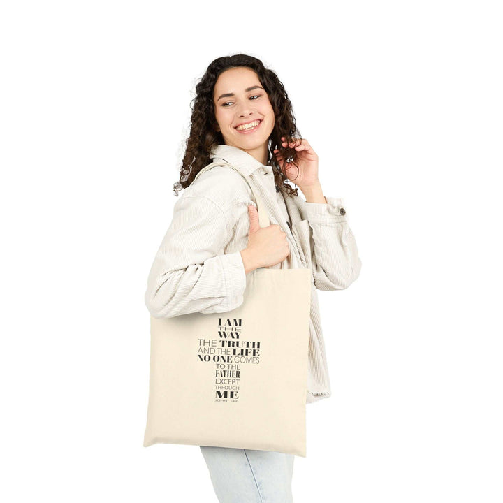 Woman carrying natural color 100% cotton Bible Quote Tote Bag