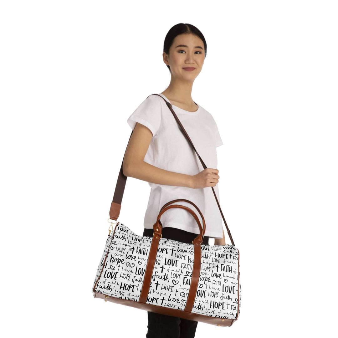 Woman holding a Faith Travel Bag with brown PU leather handles