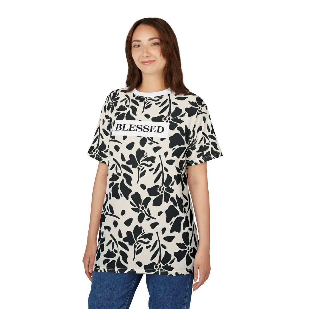 Woman wearing Blessed floral pattern t-shirt with "BLESSED" text