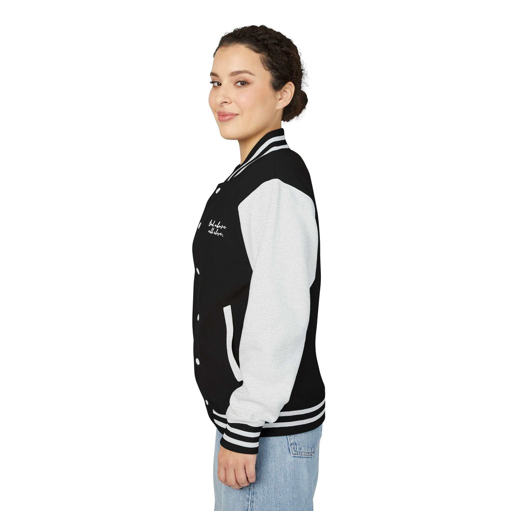 Woman wearing God First baseball jacket