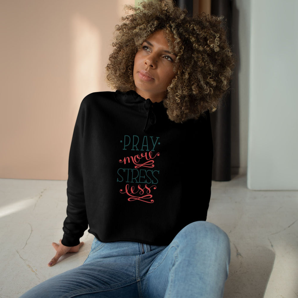 Woman wearing Pray More Crop Hoodie "Pray more stress less" text