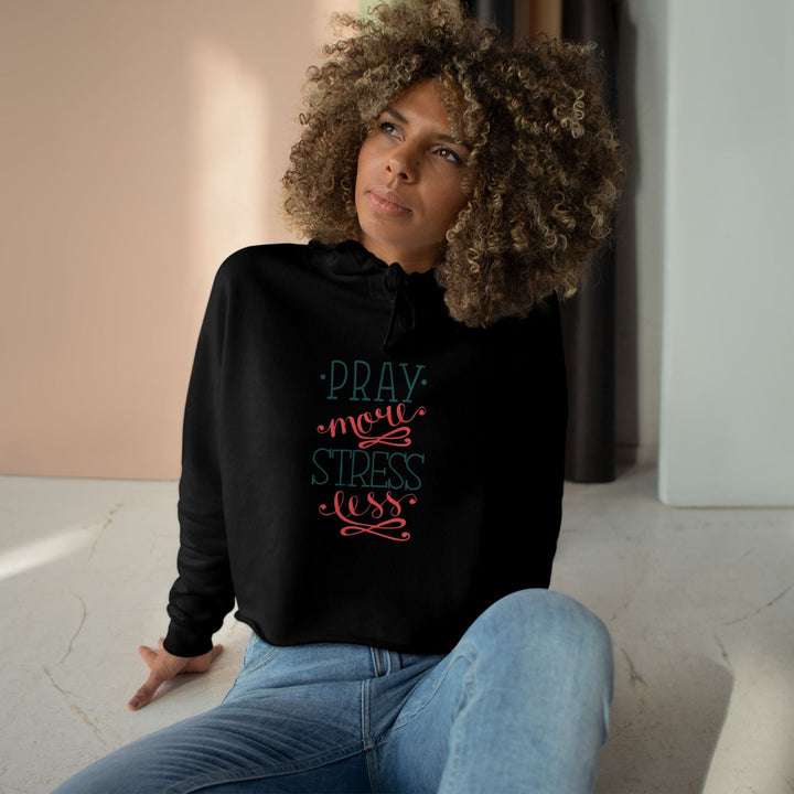 Woman wearing Pray More Crop Hoodie "Pray more stress less" text