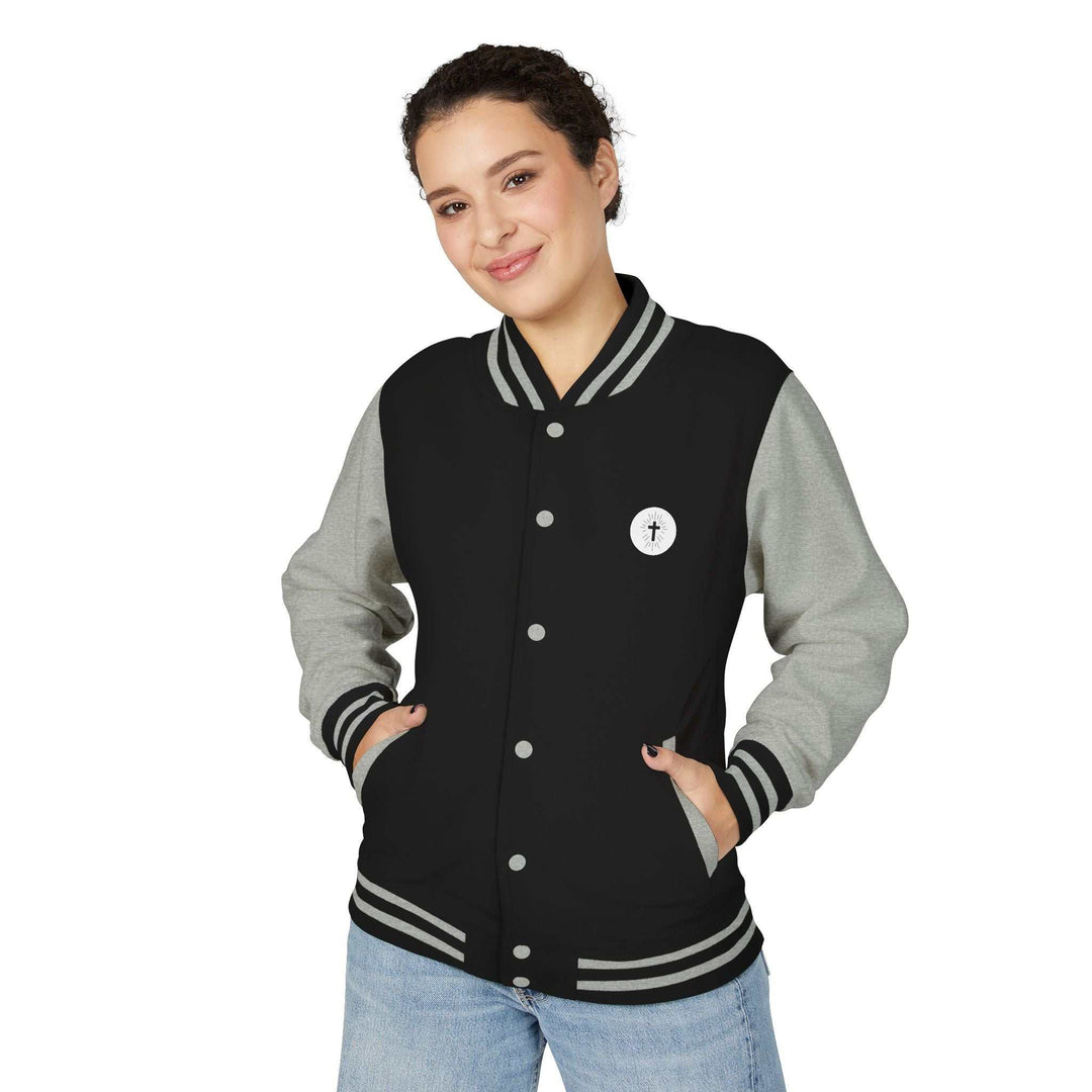 woman wearing black and gray Christian Cross jacket with striped collar and cuffs