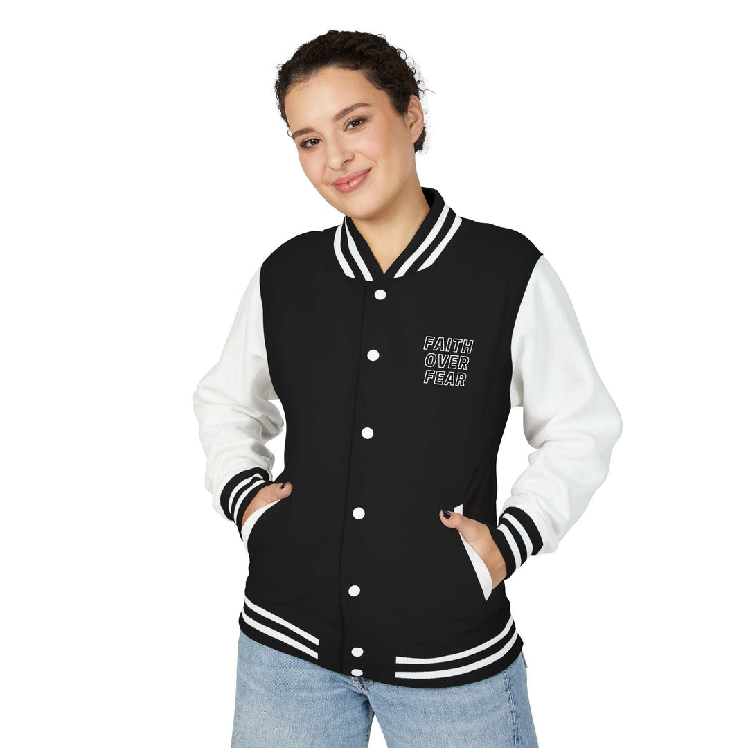 Black and white varsity jacket with "Faith Over Fear" text, made of cotton and polyester blend, medium-heavy fabric for warmth and style