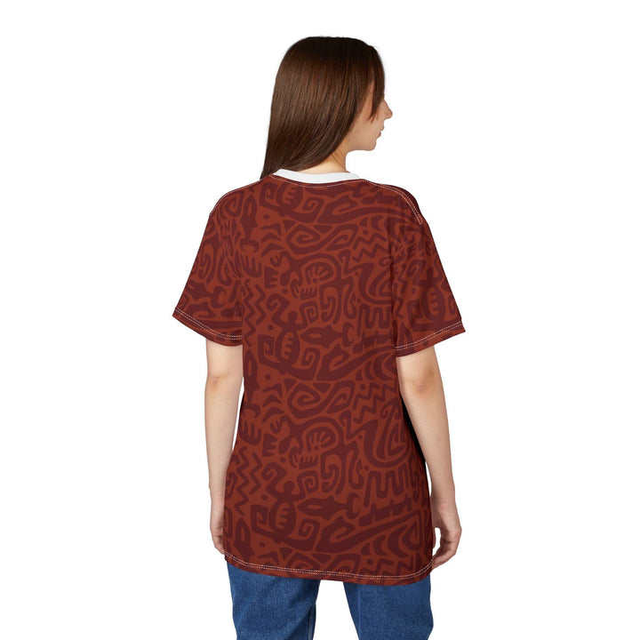 Woman wearing a brown Blessed T-Shirt with abstract patterns