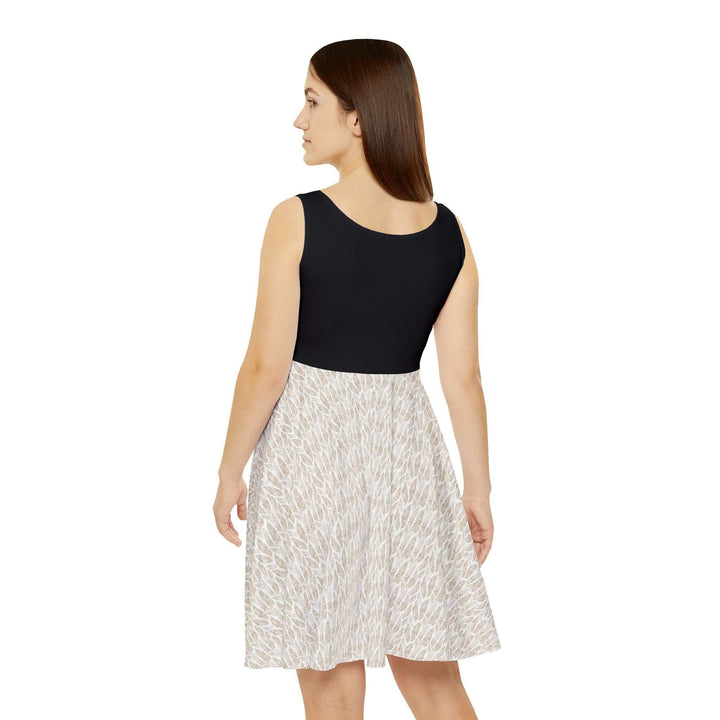 Woman wearing a mid-length Hearts Skater Dress with a black top