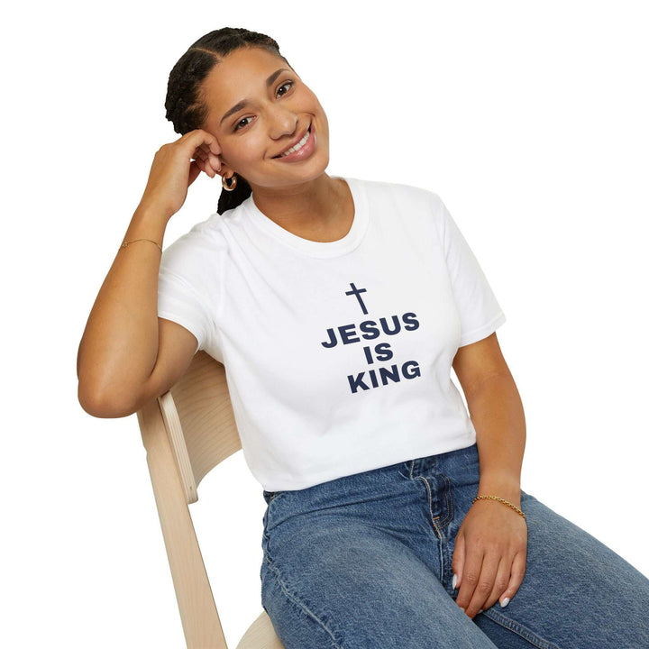 Woman wearing a white Jesus Is King T-Shirt with cross print