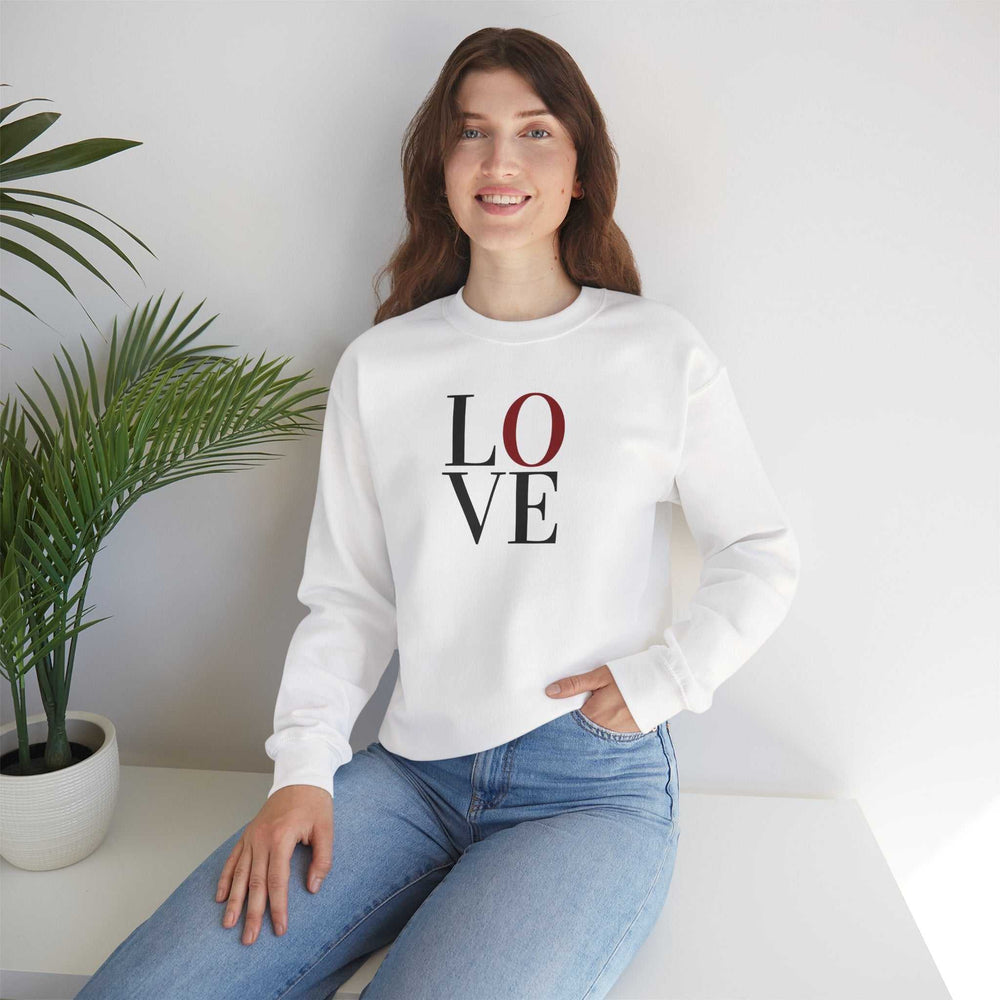 Woman wearing a white heavy blend Love Sweatshirt