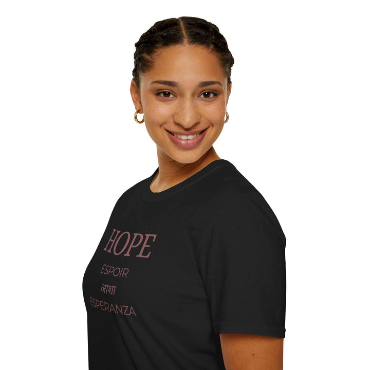 Woman wearing black Hope T-Shirt with message of strength and faith in multiple languages, classic fit, made of 100% ring-spun cotton.