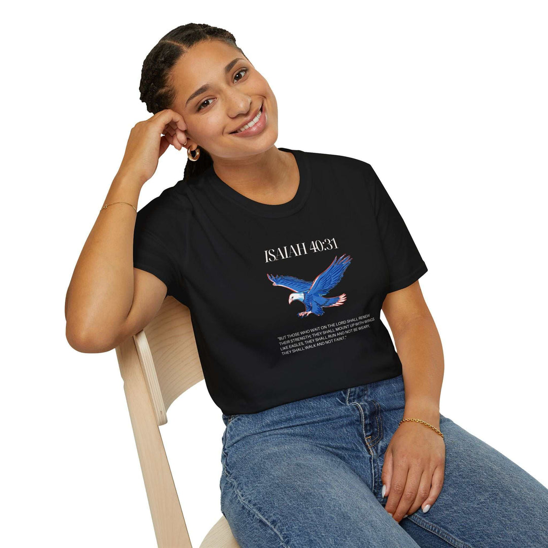 Woman wearing black Isaiah 40:31 T-shirt with blue eagle graphic and faith message, paired with blue jeans, sitting on wooden chair
