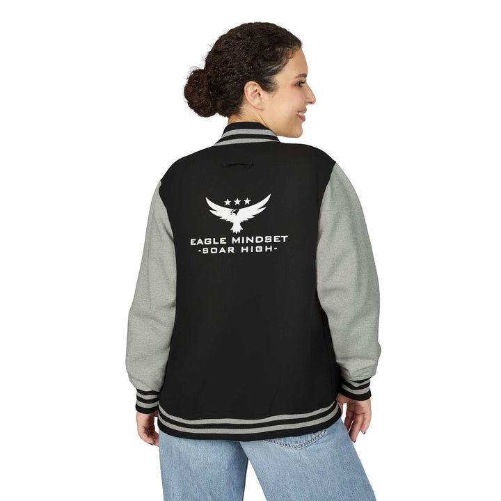 Woman wearing black and gray Eagle Mindset jacket with graphic and striped cuffs and collar