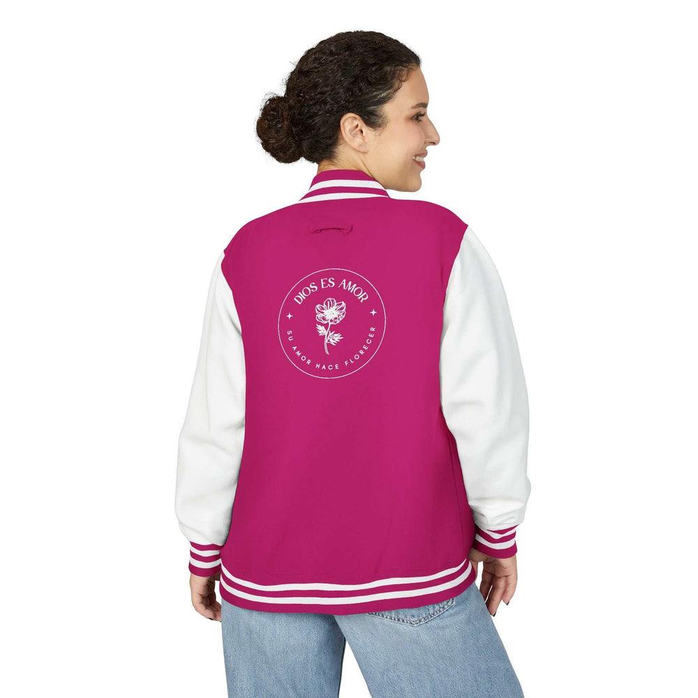 Woman wearing a pink and white Dios Es Amor jacket with faith message and rose graphic on back