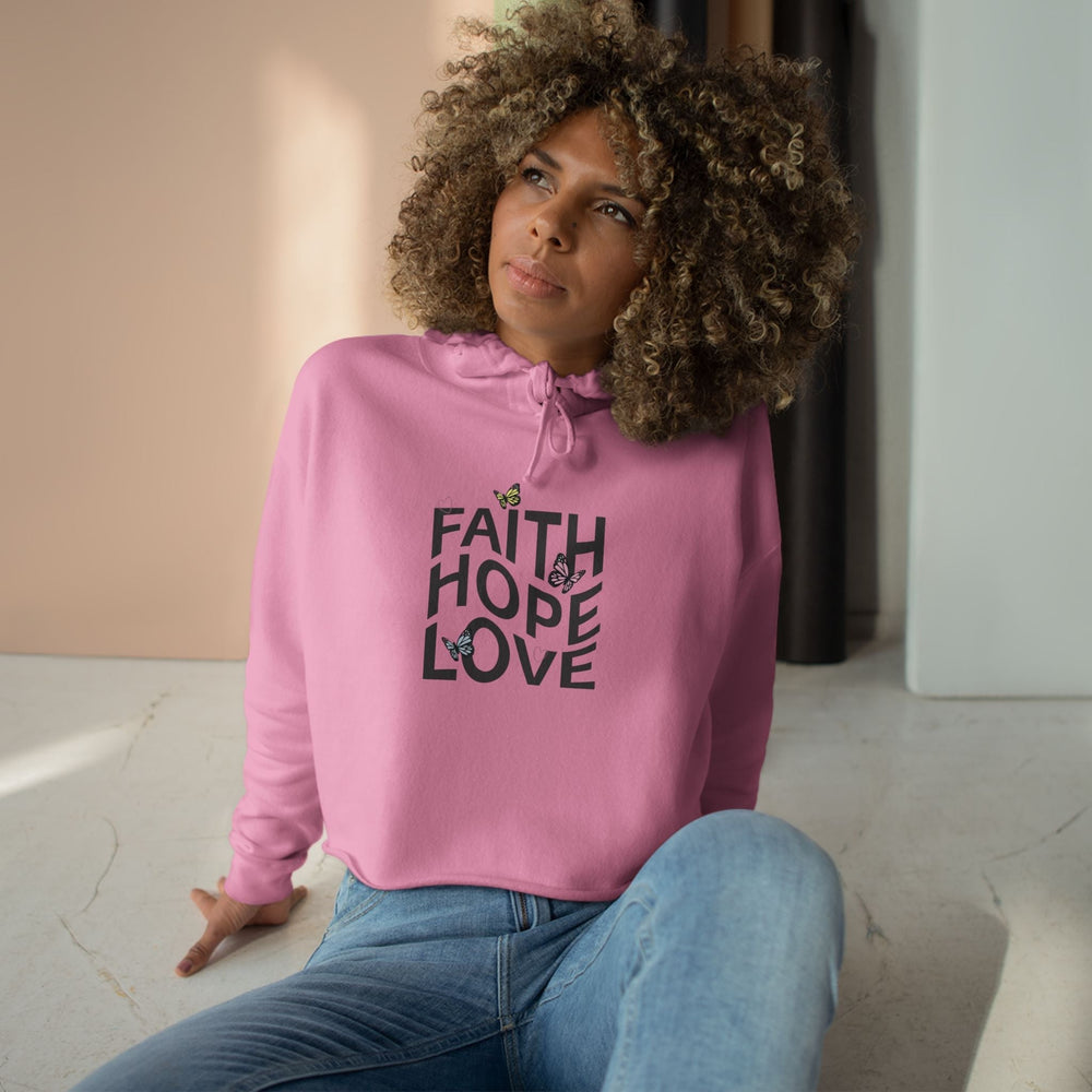 Woman wearing pink Faith Hope Crop Hoodie with butterfly design