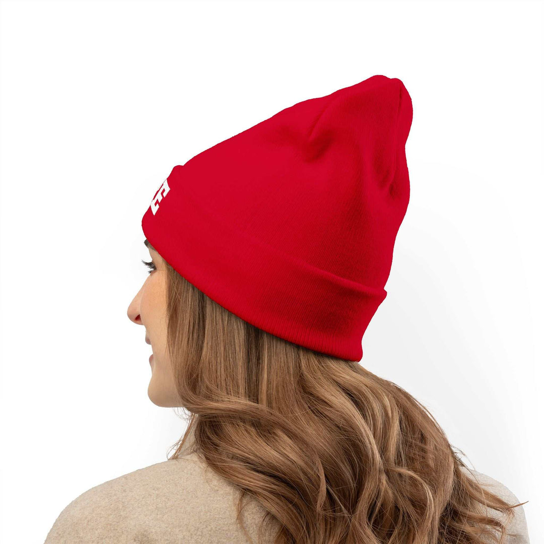 Woman wearing a red Hope Knit Beanie made of cotton and acrylic blend with a form-fitting shape