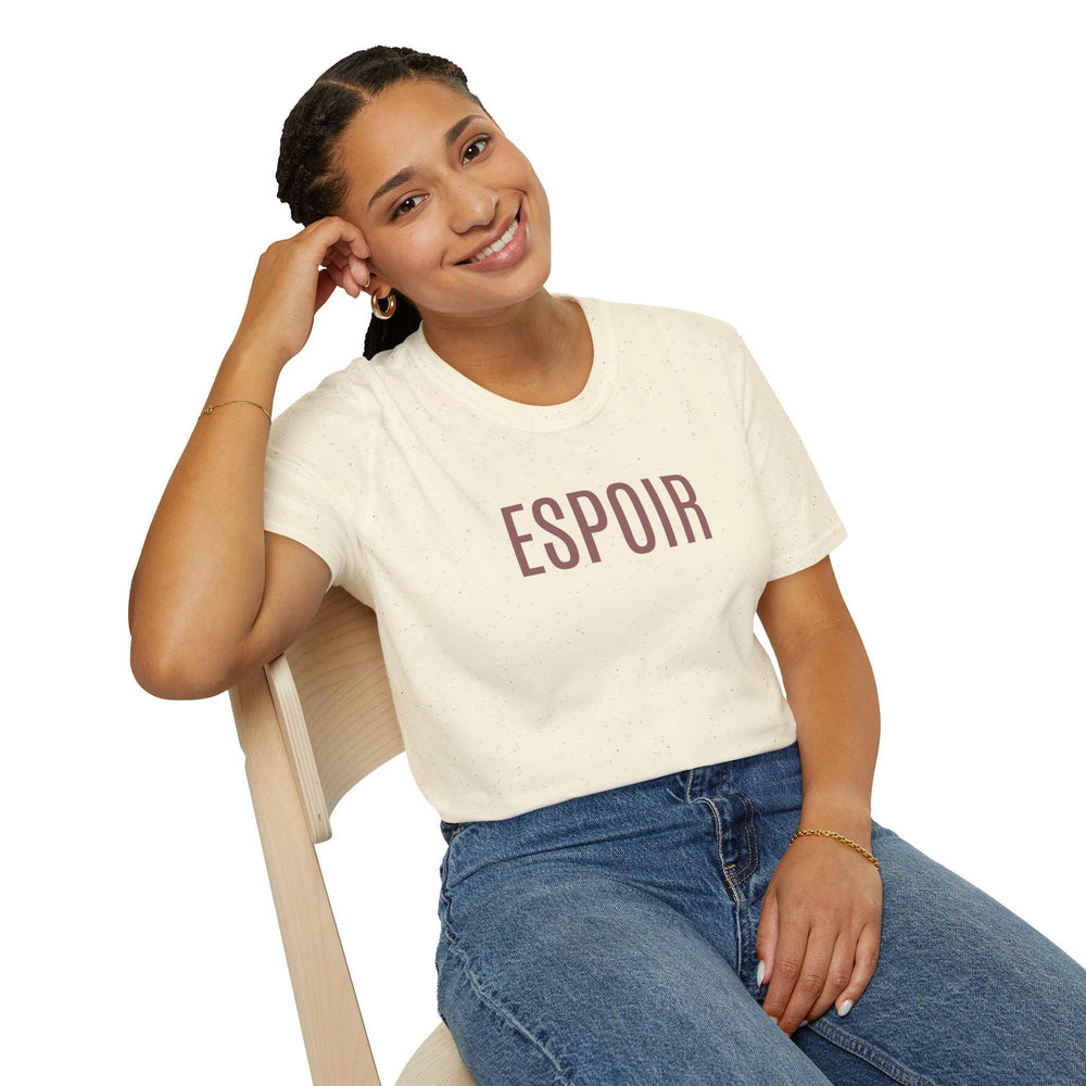 Woman wearing a cream-colored Espoir T-Shirt with French design and classic fit sitting on a wooden chair