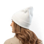 Woman wearing white Faith Knit Beanie made of breathable cotton blend