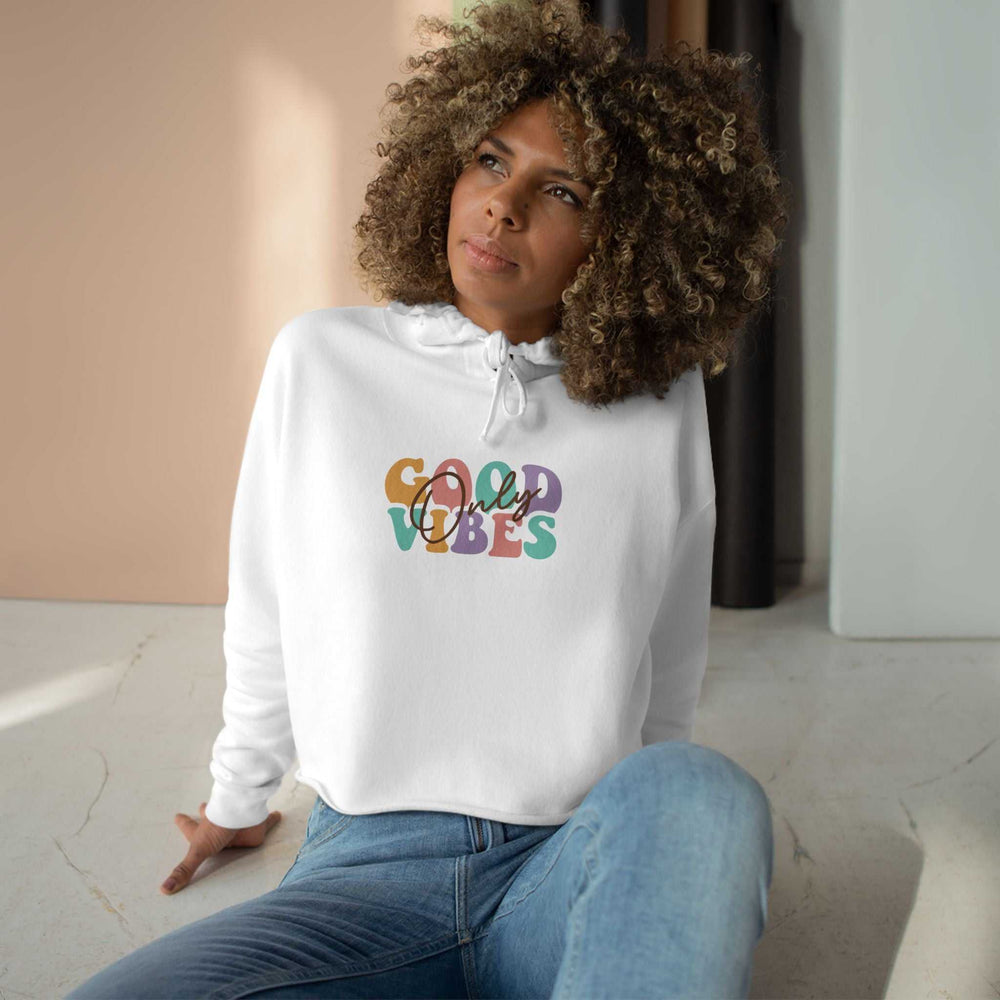 Woman wearing white Good Vibes Crop Hoodie with colorful print