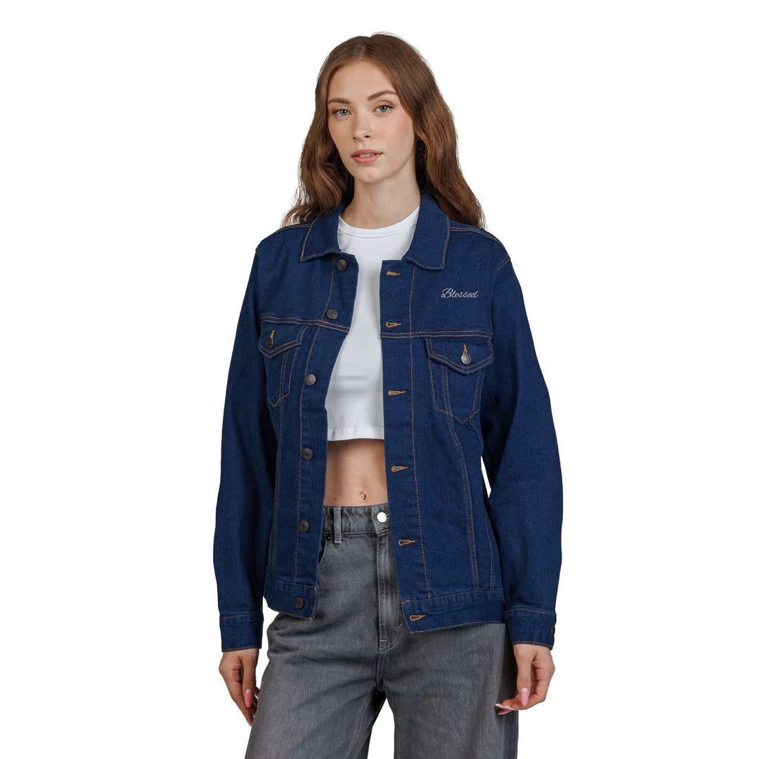 Woman wearing a dark blue Blessed Denim Jacket with buttoned chest pockets over a white crop top and gray pants